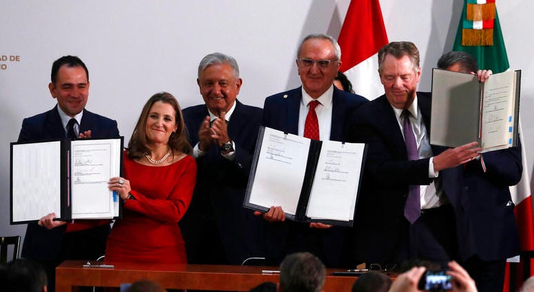 Mexico's Treasury Secretary Arturo Herrera, left, Deputy Prime Minister of Canada Chrystia Freeland, second left, Mexico's President Andres Manuel Lopez Obrador, center, Mexico's top trade negotiator Jesus Seade, second right, and U.S. Trade Representativ Mexico's Treasury Secretary Arturo Herrera, left, Deputy Prime Minister of Canada Chrystia Freeland, second left, Mexico's President Andres Manuel Lopez Obrador, center, Mexico's top trade negotiator Jesus Seade, second right, and U.S. Trade Representativ