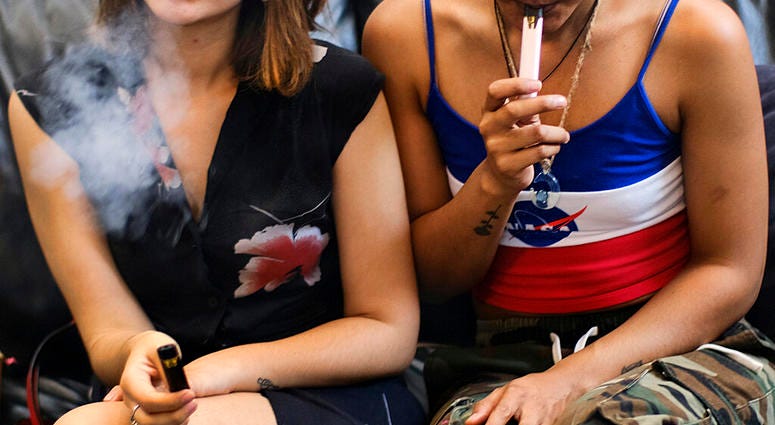 two women smoke cannabis vape pens at a party in Los Angeles. On Thursday, Dec. 12, 2019, U.S. health officials said 26 states have reported deaths, for a total of 52. two women smoke cannabis vape pens at a party in Los Angeles. On Thursday, Dec. 12, 2019, U.S. health officials said 26 states have reported deaths, for a total of 52.