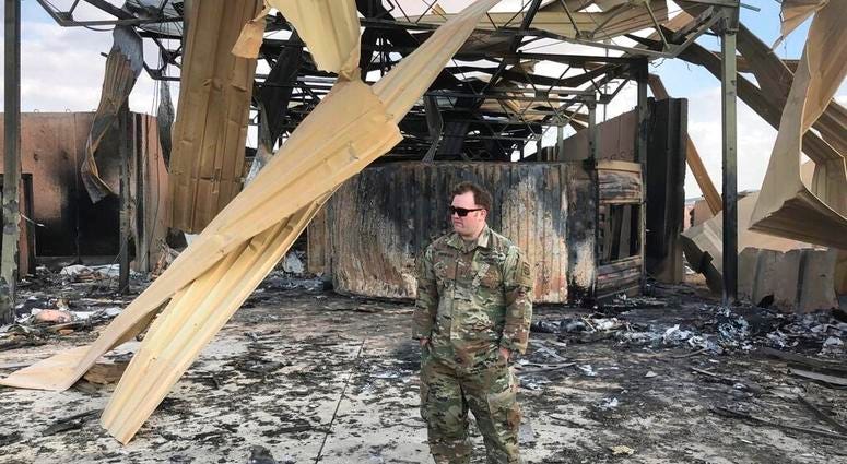 A U.S. soldier stands at a site of Iranian bombing, in Ain al-Asad air base, Anbar, Iraq, Monday, Jan. 13, 2020.