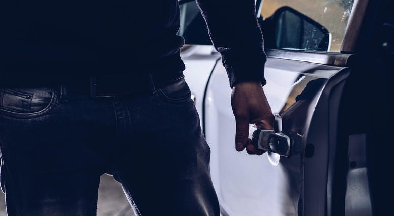 Man breaking into a car