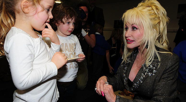 Dolly Parton talking with children