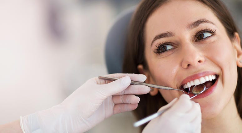 Woman having teeth examined at dentists Woman having teeth examined at dentists