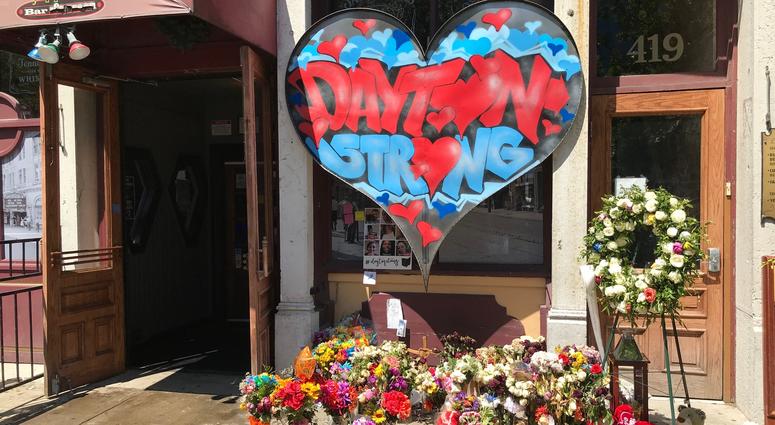 A memorial of flowers, cards, dolls and a Dayton Strong heart surround Ned Peppers outside the Aug. 4 mass shooting scene. Mass shooting memorial outside Ned Peppers A memorial of flowers, cards, dolls and a Dayton Strong heart surround Ned Peppers outside the Aug. 4 mass shooting scene. Mass shooting memorial outside Ned Peppers