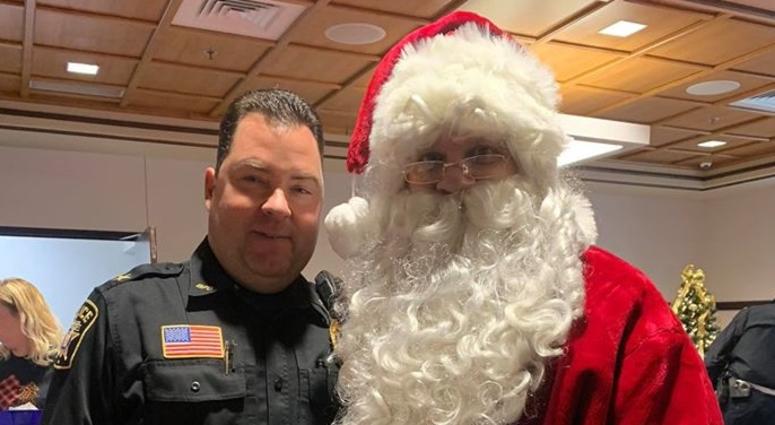 One of Bridgeville's officers with Santa Bridgeville Police Department Shop with a Cop