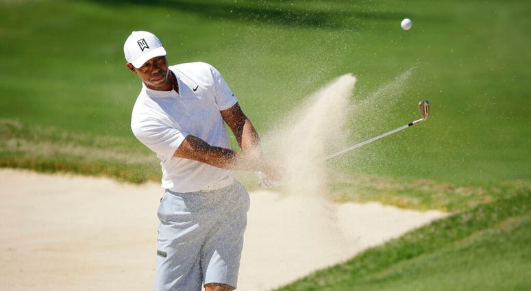 Tiger Woods plays a shot from a bunker on the 16th hole during a practice round at the Dell Match Play Championship golf tournament, Tuesday, March 26, 2019, in Austin, Texas. DO NOT USE