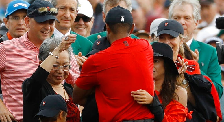 Tiger Woods hugs his family after winning the Masters golf tournament Sunday, April 14, 2019, in Augusta, Ga. AP DO NOT USE