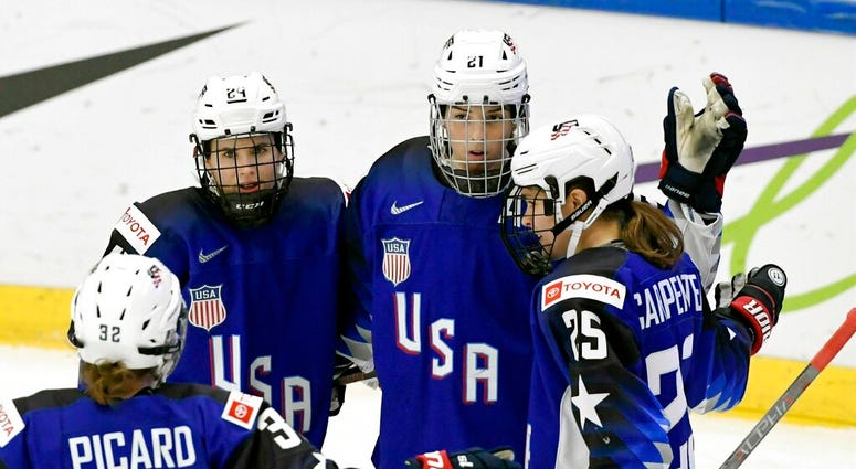 Michell Picard, Dani Cameranesi, Hilary Knight and Alex Carpenter of USA celebrate after scoring their team's first goal during the IIHF Women's Ice Hockey World Championships quarterfinal match between USA and Japan in Espoo, Finland, Thursday, April 11, Michell Picard, Dani Cameranesi, Hilary Knight and Alex Carpenter of USA celebrate after scoring their team's first goal during the IIHF Women's Ice Hockey World Championships quarterfinal match between USA and Japan in Espoo, Finland, Thursday, April 11,