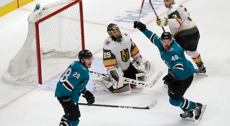 Vegas Golden Knights goaltender Marc-Andre Fleury, center, reacts between San Jose Sharks right wing Timo Meier (28) and center Tomas Hertl (48) after Sharks' Logan Couture scored a goal during the third period of Game 7 AP DO NOT USE