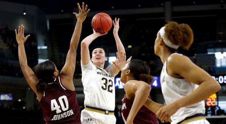 Notre Dame's Jessica Shepard (32) shoots over Texas A&M's Ciera Johnson (40) during the first half of a regional semifinal game in the NCAA women's college basketball tournament, Saturday, March 30, 2019, in Chicago. Notre Dame's Jessica Shepard (32) shoots over Texas A&M's Ciera Johnson (40) during the first half of a regional semifinal game in the NCAA women's college basketball tournament, Saturday, March 30, 2019, in Chicago.
