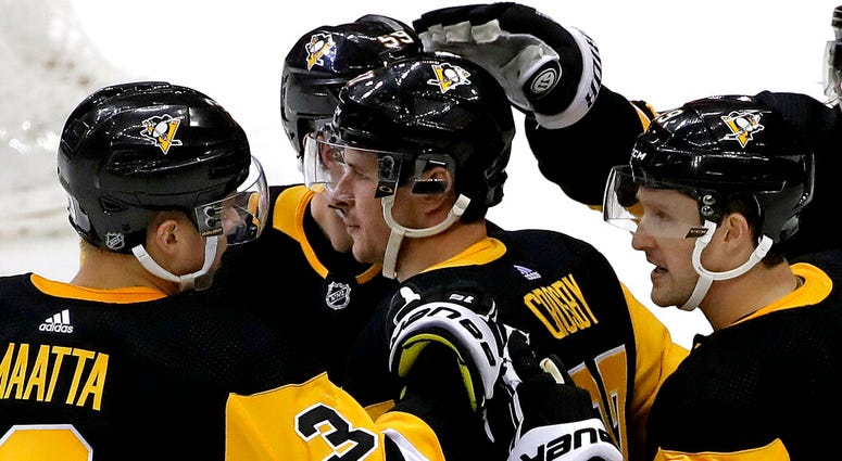 New York Rangers goaltender Alexandar Georgiev (40) blocks a shot by Pittsburgh Penguins' Jared McCann (19) during the second period of an NHL hockey game in Pittsburgh, Saturday, April 6, 2019. New York Rangers goaltender Alexandar Georgiev (40) blocks a shot by Pittsburgh Penguins' Jared McCann (19) during the second period of an NHL hockey game in Pittsburgh, Saturday, April 6, 2019.