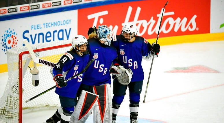 Brianna Decker, left, Alex Rigsby and Cayla Barnes of USA celebrate winning the 2019 IIHF Women's World Championships preliminary match between USA and Canada in Espoo, Finland, Saturday April 6, 2019. ( Brianna Decker, left, Alex Rigsby and Cayla Barnes of USA celebrate winning the 2019 IIHF Women's World Championships preliminary match between USA and Canada in Espoo, Finland, Saturday April 6, 2019.