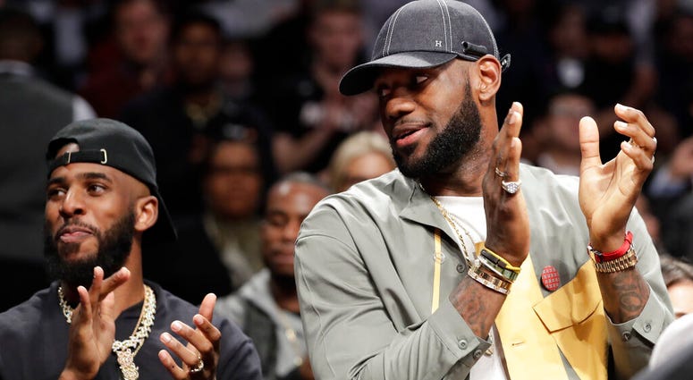 Chris Paul and LeBron James applaud during a ceremony at an NBA basketball game between the Brooklyn Nets and the Miami Heat, Wednesday, April 10, 2019, in New York. The pair were there to watch Heat guard Dwyane Wade play his last NBA game Chris Paul and LeBron James applaud during a ceremony at an NBA basketball game between the Brooklyn Nets and the Miami Heat, Wednesday, April 10, 2019, in New York. The pair were there to watch Heat guard Dwyane Wade play his last NBA game