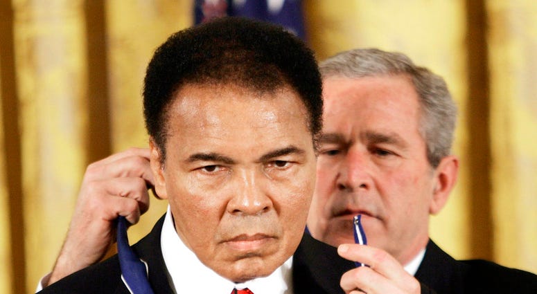 President Bush presents the Presidential Medal of Freedom to boxer Muhammad Ali in the East Room of the White House. DO NOT USE