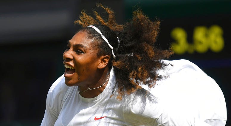 Serena Williams of the US serves to Julia Goerges of Germany during their women's semifinal