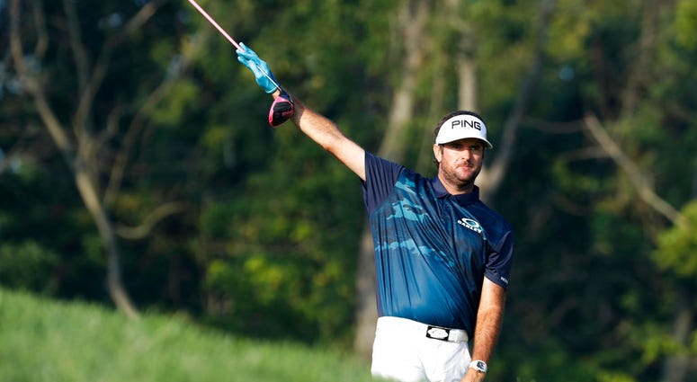Bubba Watson points in the direction of his tee shot on the 12th hole during the second round of the PGA Championship golf tournament at Bellerive Country Club, Friday, Aug. 10, 2018, in St. Louis. DO NOT USE