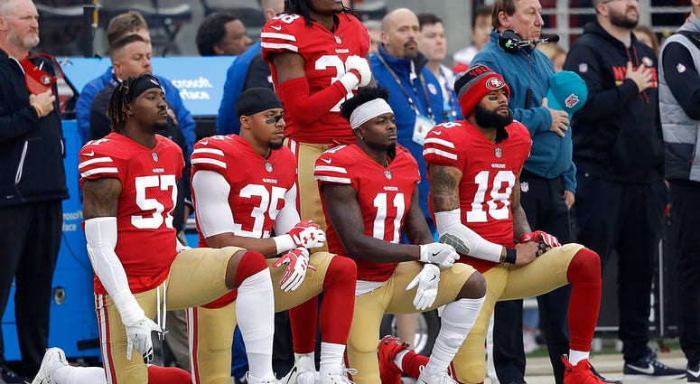 - In this Dec. 24, 2017, file photo, San Francisco 49ers outside linebacker Eli Harold, from bottom left, kneels with safety Eric Reid, wide receiver Marquise Goodwin and wide receiver Louis Murphy during the national anthem before an NFL football game DO NOT USE