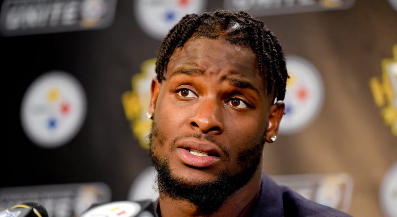 In this Oct. 22, 2017, file photo, Pittsburgh Steelers running back Le'Veon Bell (26) answers questions at a post-game meeting with reporters DO NOT USE