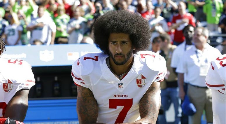n this Sept. 25, 2016, file photo, San Francisco 49ers' Colin Kaepernick kneels during the national anthem before an NFL football game against the Seattle Seahawks, DO NOT USE