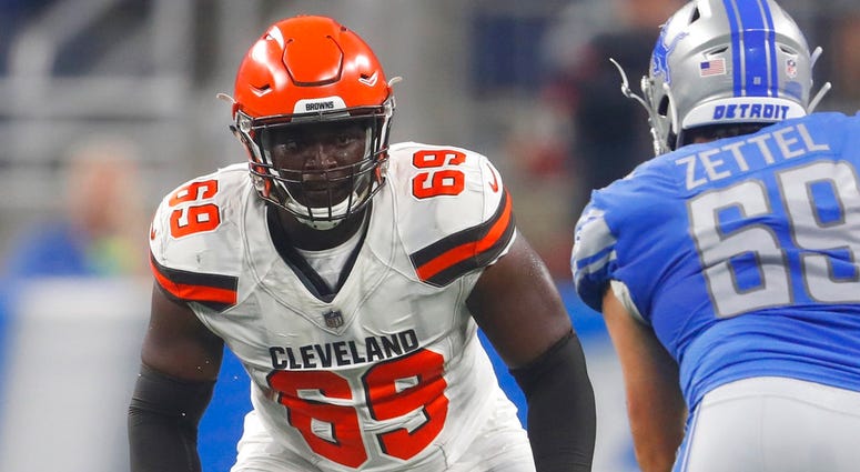 in this Aug. 30, 2018, file photo, Cleveland Browns offensive tackle Desmond Harrison (69) defends the line as Detroit Lions defensive end Anthony Zettel (69) rushes during the first half of an NFL football preseason game, in Detroit. DO NOT USE