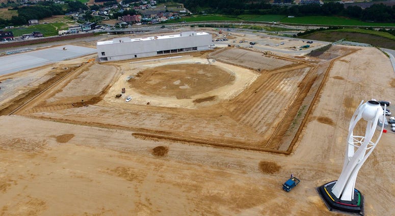 file photo, shows a general aerial view of the dismantled stadium for the opening and closing ceremonies of the 2018 Pyeongchang Winter Olympics with the Olympic cauldron, right, in Pyeongchang, South Korea. Pyeongchang is already considering razing DO NOT USE