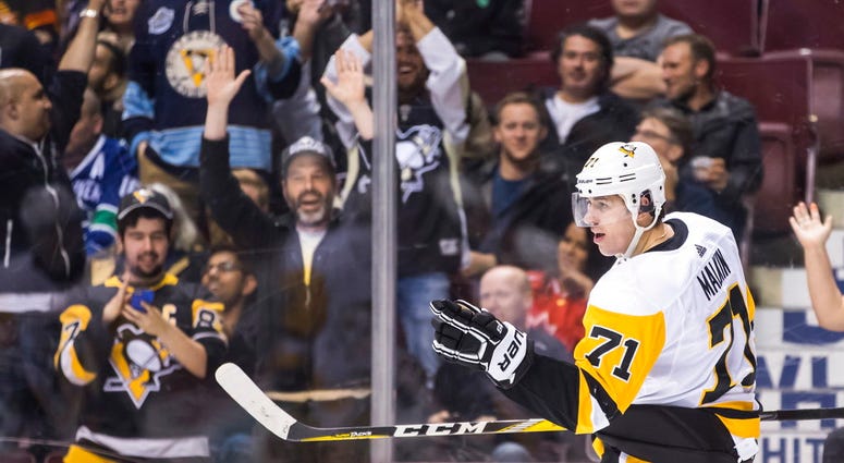 Pittsburgh Penguins' Evgeni Malkin, of Russia, celebrates his first goal against the Vancouver Canucks during the third period of an NHL hockey game in Vancouver, British Columbia, Saturday, Oct. 27, 2018. DO NOT USE