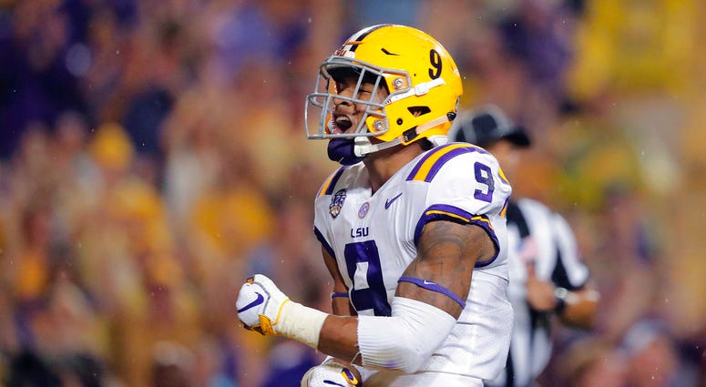 In this Sept. 29, 2018, file photo, LSU safety Grant Delpit (9) celebrates his sack of Mississippi quarterback Jordan Ta'amu during the first half DO NOT USE