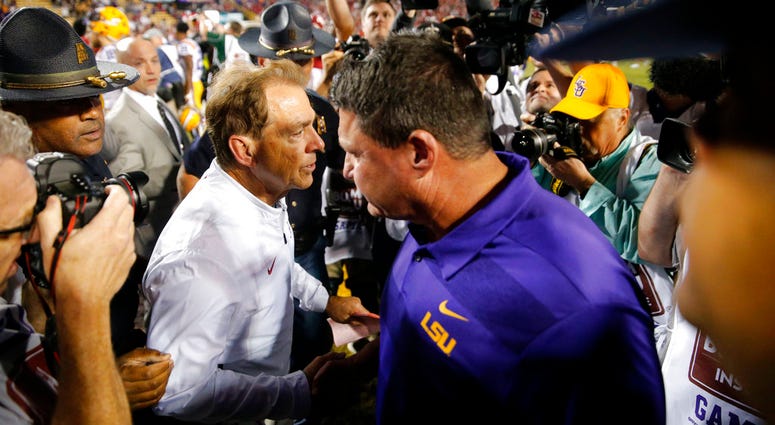 Alabama head coach Nick Saban, left, shakes hands with LSU head coach Ed Orgeron Alabama head coach Nick Saban, left, shakes hands with LSU head coach Ed Orgeron
