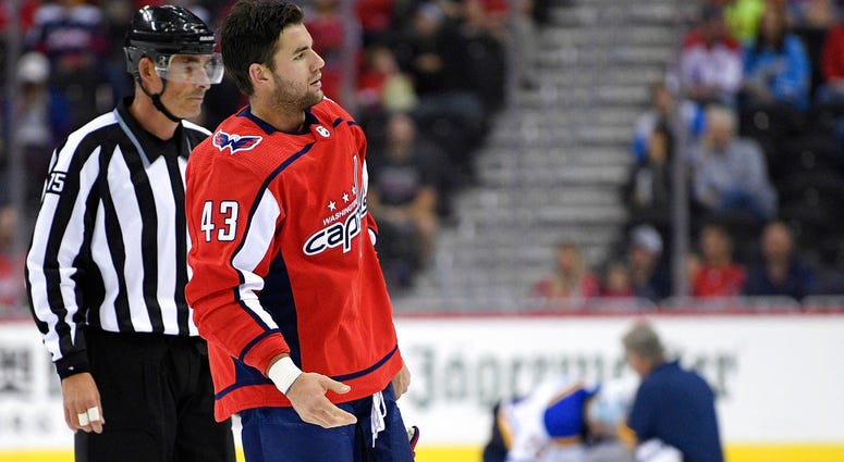 Washington Capitals Tom Wilson is escorted by an official off the ice after he checked St. Louis Blues Oskar Sundqvist Washington Capitals Tom Wilson is escorted by an official off the ice after he checked St. Louis Blues Oskar Sundqvist