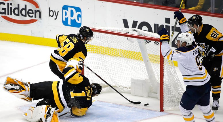 Buffalo Sabres' Jack Eichel (9) celebrates his game-winning overtime goal past Pittsburgh Penguins goaltender Casey DeSmith Buffalo Sabres' Jack Eichel (9) celebrates his game-winning overtime goal past Pittsburgh Penguins goaltender Casey DeSmith