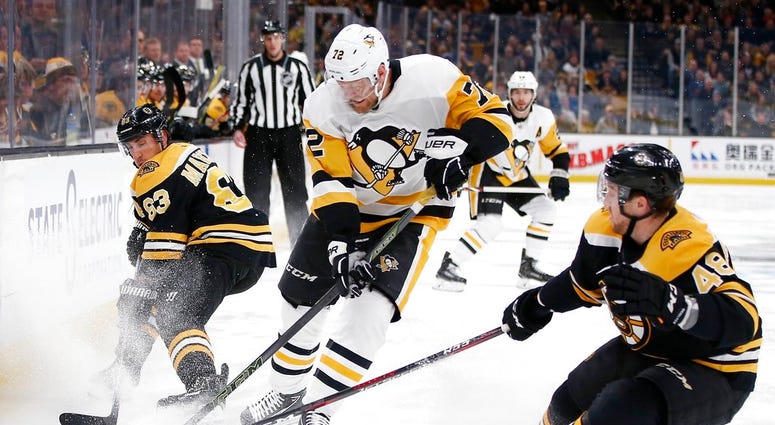 Pittsburgh Penguins' Patric Hornqvist (72) battles Boston Bruins' Brad Marchand Pittsburgh Penguins' Patric Hornqvist (72) battles Boston Bruins' Brad Marchand