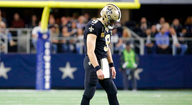 New Orleans Saints quarterback Drew Brees (9) walks off of the field in the first half of an NFL football game against the Dallas Cowboys, in Arlington, Texas, Thursday, Nov. 29, 2018. DO NOT USE