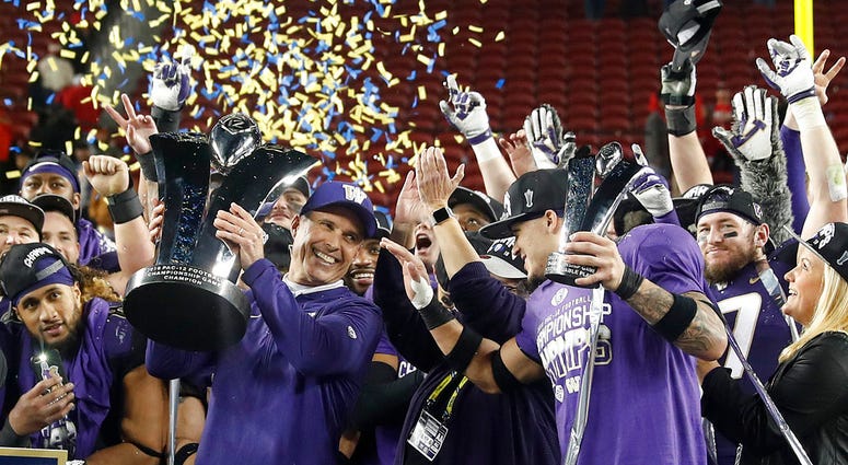 Washington coach Chris Petersen, center left, and defensive back Byron Murphy, center right, celebrate after Washington defeated Utah 10-3 in the Pac-12 Conference championship Washington coach Chris Petersen, center left, and defensive back Byron Murphy, center right, celebrate after Washington defeated Utah 10-3 in the Pac-12 Conference championship