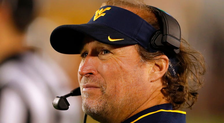 In this Oct. 13, 2018 file photo West Virginia head coach Dana Holgorsen watches from the sideline during the second half of an NCAA college football game against Iowa State DO NOT USE