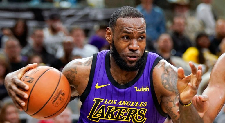 In this Dec. 7, 2018, file photo, Los Angeles Lakers' LeBron James (23) drives against the San Antonio Spurs during the first half of an NBA basketball game, DO NOT USE