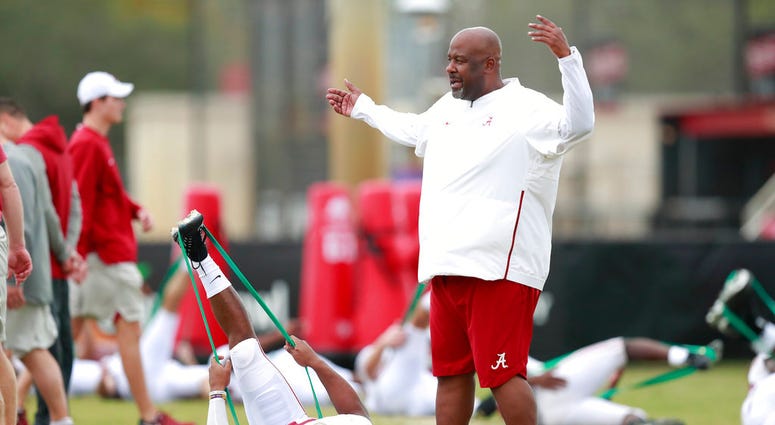 Alabama offensive coordinator Mike Locksley talks to Alabama running back Damien Harris during an NCAA college football practice on Wednesday, Dec. 26, 2018, in Miami Shores, Fla. Alabama plays Oklahoma in the Orange Bowl on Dec. 29. DO NOT USE