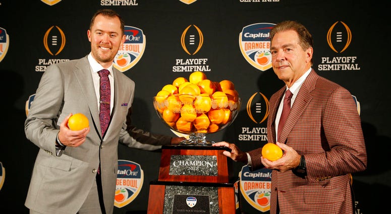 Alabama head coach Nick Saban, right, stands with Oklahoma head coach Lincoln Riley Alabama head coach Nick Saban, right, stands with Oklahoma head coach Lincoln Riley