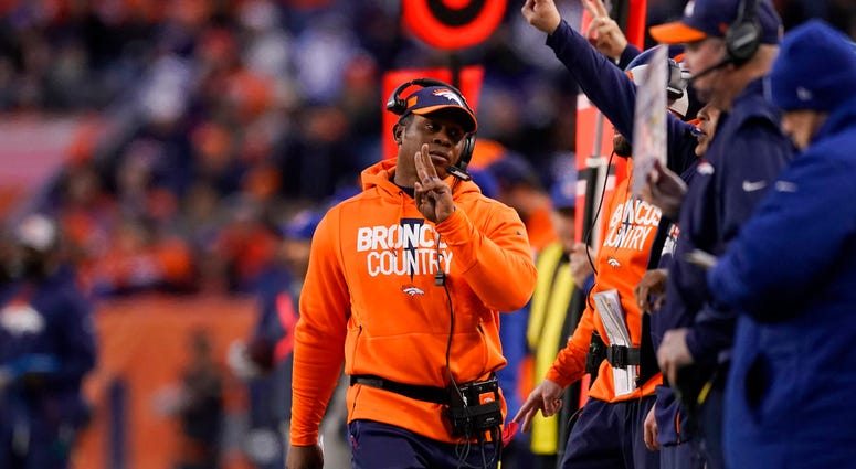 Denver Broncos head coach Vance Joseph, center, reacts on the sideline during the second half of an NFL football game against the Los Angeles Chargers, Sunday, Dec. 30, 2018, in Denver. DO NOT USE