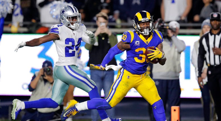 Los Angeles Rams running back Todd Gurley scores past Dallas Cowboys Los Angeles Rams running back Todd Gurley scores past Dallas Cowboys