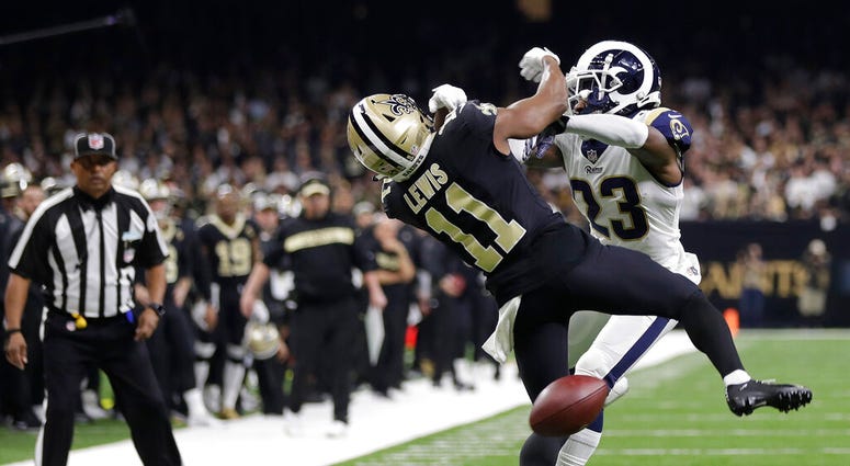 New Orleans Saints wide receiver Tommylee Lewis (11) works for a catch against Los Angeles Rams defensive back Nickell Robey-Coleman New Orleans Saints wide receiver Tommylee Lewis (11) works for a catch against Los Angeles Rams defensive back Nickell Robey-Coleman