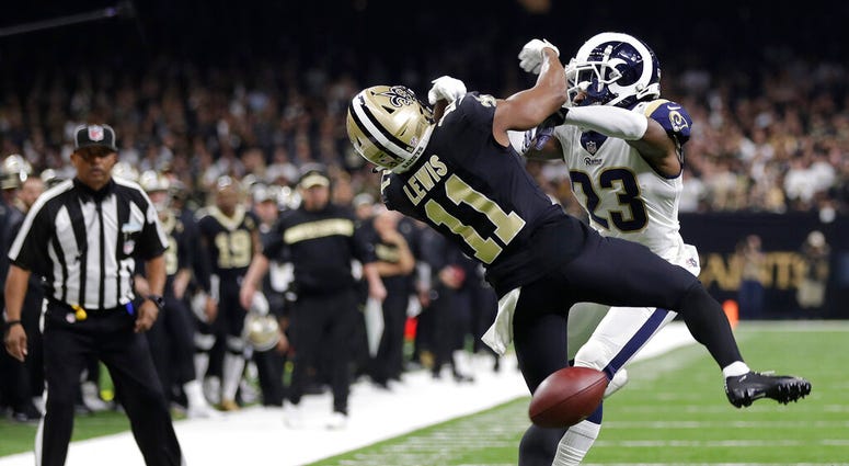 New Orleans Saints wide receiver Tommylee Lewis (11) works for a coach against Los Angeles Rams defensive back Nickell Robey-Coleman New Orleans Saints wide receiver Tommylee Lewis (11) works for a coach against Los Angeles Rams defensive back Nickell Robey-Coleman