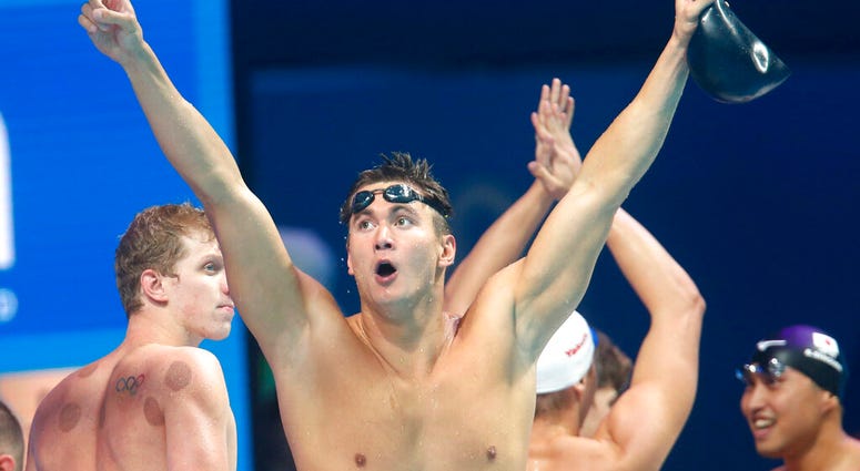 United States' Nathan Adrian celebrates after winning the gold medal in the men's 4x100-meter freestyle final during the swimming competitions of the World Aquatics Championships in Budapest, Hungary. AP DO NOT USE