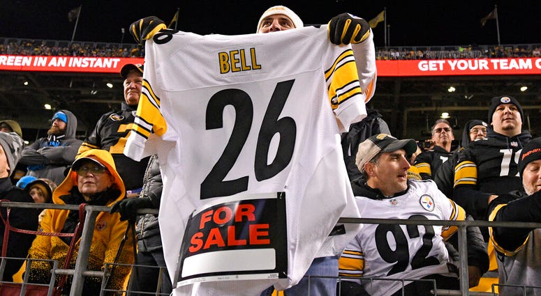 a Pittsburgh Steelers fan holds a Le'Veon Bell jersey a Pittsburgh Steelers fan holds a Le'Veon Bell jersey