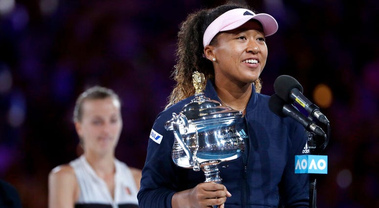 Japan's Naomi Osaka holds her trophy after defeating Petra Kvitova, left, of the Czech Republic during the women's singles final at the Australian Open tennis championships in Melbourne, Australia, Saturday, Jan. 26, 2019 Japan's Naomi Osaka holds her trophy after defeating Petra Kvitova, left, of the Czech Republic during the women's singles final at the Australian Open tennis championships in Melbourne, Australia, Saturday, Jan. 26, 2019