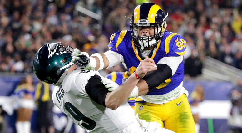 Los Angeles Rams defensive end Aaron Donald hits Philadelphia Eagles quarterback Nick Foles Los Angeles Rams defensive end Aaron Donald hits Philadelphia Eagles quarterback Nick Foles