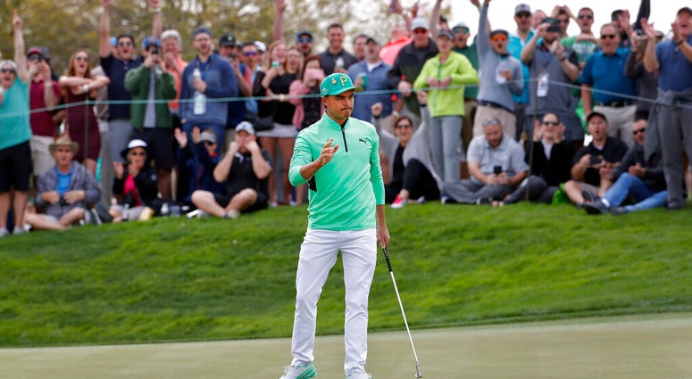 Rickie Fowler waves after making a birdie putt on the fifth green during the third round of the Phoenix Open PGA golf tournament, Saturday, Feb. 2, 2019 Rickie Fowler waves after making a birdie putt on the fifth green during the third round of the Phoenix Open PGA golf tournament, Saturday, Feb. 2, 2019