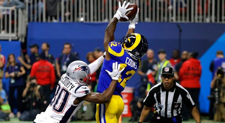 New England Patriots' Jason McCourty (30) breaks up a pass intended for Los Angeles Rams' Brandin Cooks (12) during the second half of the NFL Super Bowl 53 football game Sunday, Feb. 3, 2019, in Atlanta. DO NOT USE