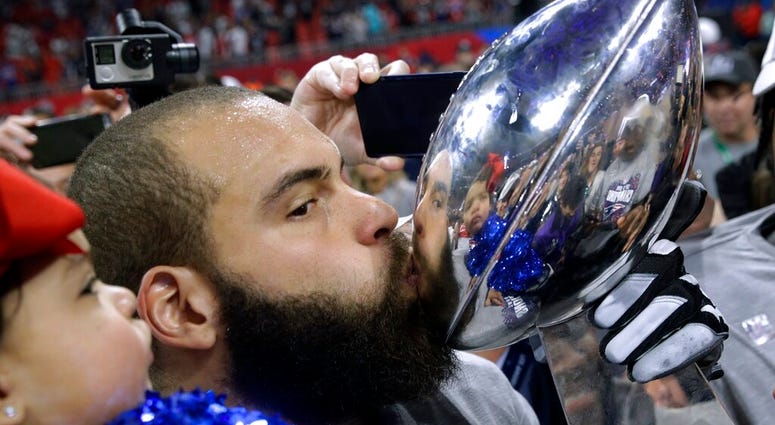 New England Patriots' Lawrence Guy kisses the trophy after the NFL Super Bowl 53 football game against the Los Angeles Rams, Sunday, Feb. 3, 2019, in Atlanta New England Patriots' Lawrence Guy kisses the trophy after the NFL Super Bowl 53 football game against the Los Angeles Rams, Sunday, Feb. 3, 2019, in Atlanta