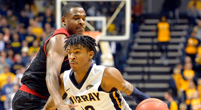Murray State guard Ja Morant (12) attempts to drive past the defense of SIU Edwardsville guard Cameron Williams (24) during the second half of an NCAA college basketball game in Murray, Ky., Saturday, Feb. 9, 2019 DO NOT USE