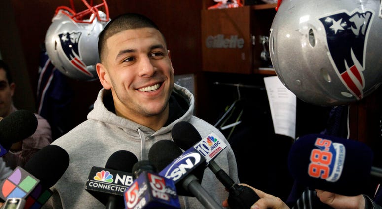 New England Patriots tight end Aaron Hernandez speaks to reporters at his locker at the NFL football stadium in Foxborough, Mass. AP DO NOT USE