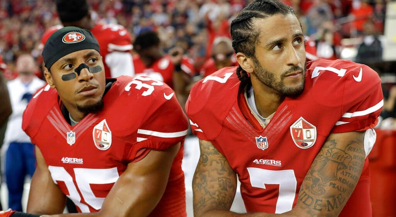 San Francisco 49ers safety Eric Reid (35) and quarterback Colin Kaepernick (7) kneel during the national anthem before an NFL football game AP DO NOT USE